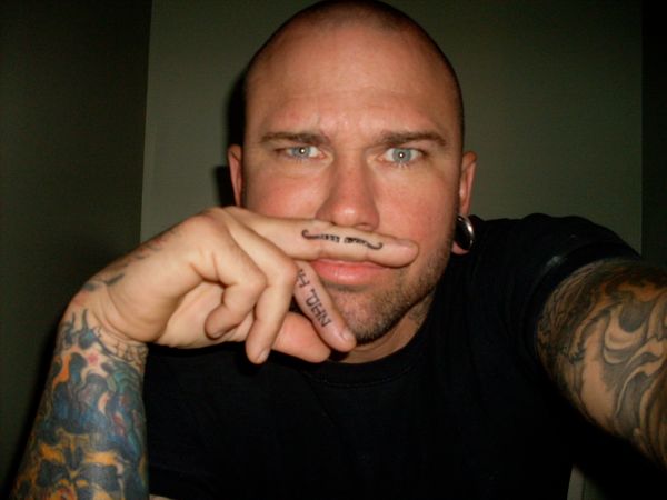 finger-moustache-tattoos