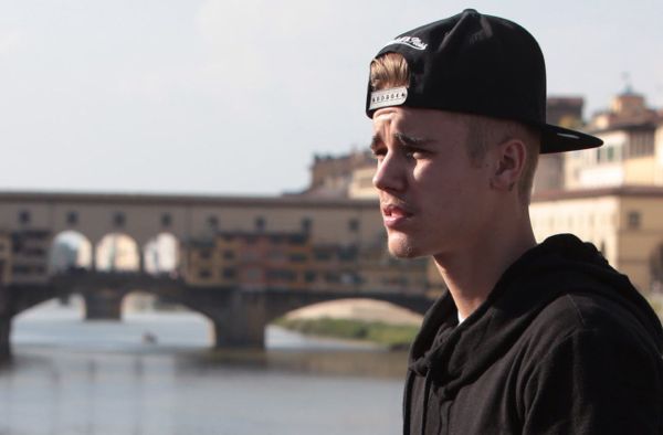 EXCLUSIVE: Justin Bieber posing in Florence, with the Ponte Vecchio in the background